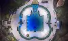 Espada-Amenity-Center-full-aerial-completed-pool-at-night-3cs-construction